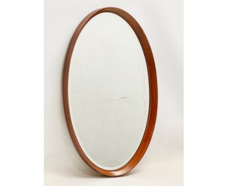 A G-Plan Mid Century teak framed oval mirror. 43x71cm
