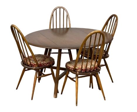 An Ercol Mid Century dining table and 4 chairs. Quaker model 365 chairs and model 377 drop leaf dining table. Open 124x113x71