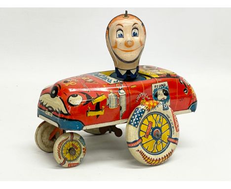 A vintage tin plate ‘Crazy Cop’ windup toy. Made in Great Britain 16x14cm 