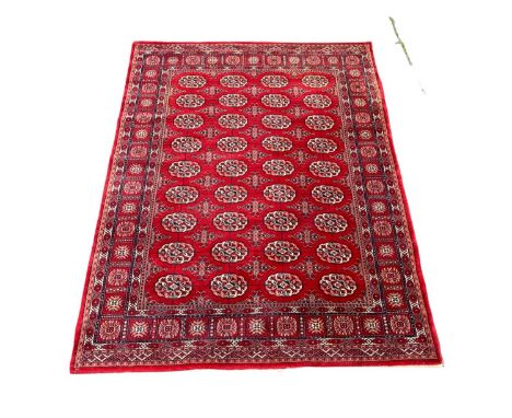 A vintage Middle Eastern style rug.  240x169cm 