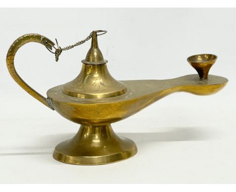 An early 20th century Middle Eastern Aladdin brass lamp. 21cm 