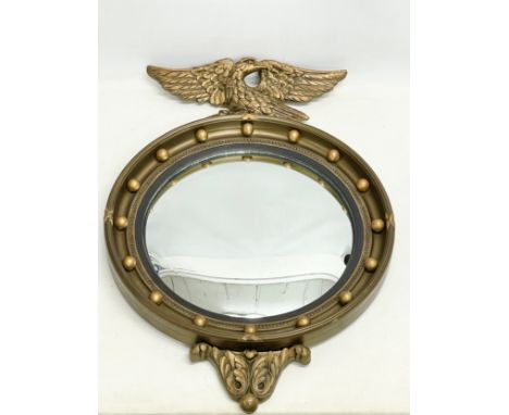 A vintage Regency style gilt framed convex mirror. 48x71cm 