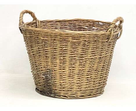 A large vintage heavy wicker basket. 55x51x40cm 