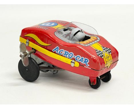 A vintage tinplate windup Yone ‘Acro Car’ made in Japan. 9cm 