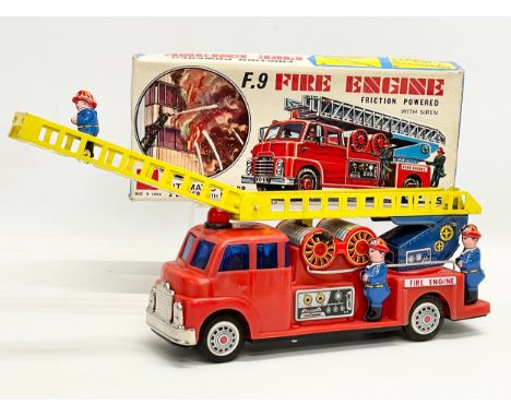 A vintage tinplate Kokyu friction powered F.9 Fire Engine in original box. Made in Japan. Fire engine measures 26cm closed. 