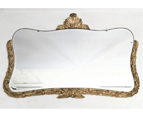 A 1930s ornate framed bevelled mirror. 74x53cm 