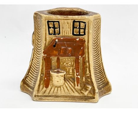 A vintage pottery match striker/holder. 7x7x7cm 