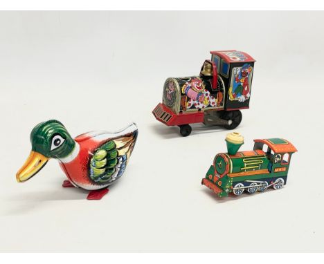 3 vintage tinplate toys. A Japanese Circus Loco Train. A West German Duck. A Mettoy M816 Train. 