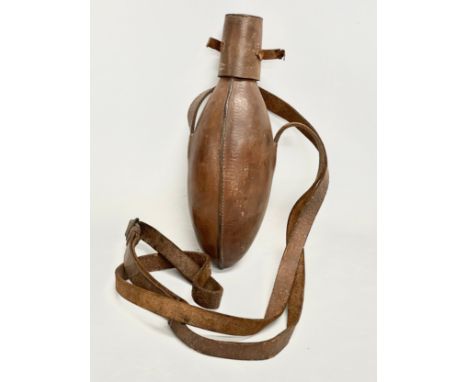 A Victorian leather bound flask. 25cm. 