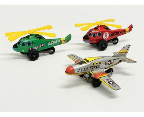 3 vintage Japanese tinplate toys. A U.S Air Force plane, an Army Helicopter and an Emergency Helicopter. 10cm 