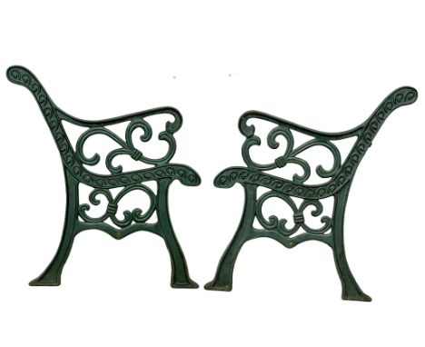 A pair of large cast iron garden bench ends. 72x77.5cm 