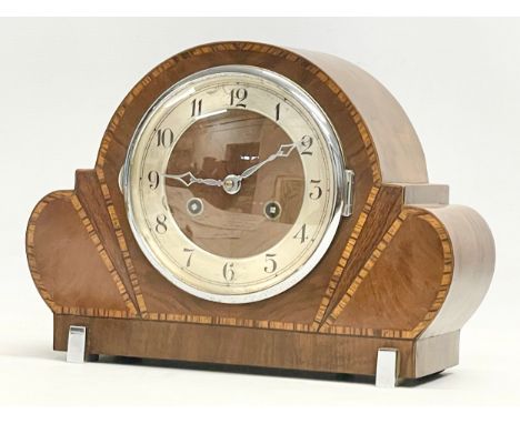 A good quality Art Deco inlaid walnut mantle clock with 2 chromed feet. With pendulum. 31x11x23cm 