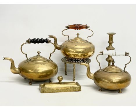 A collection of Victorian brassware. 3 Victorian rasa kettles, a trivet stand, candlestick etc. 