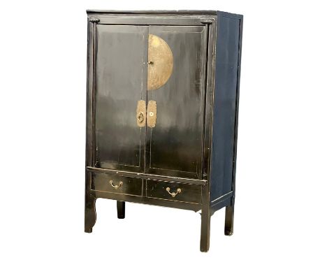 A large vintage Chinese lacquered cabinet with 2 exterior drawers and 2 interior drawers. 107x60x176.5cm 