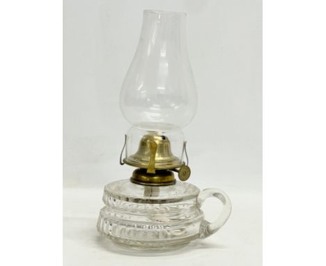 A Victorian glass finger lamp. 25cm 