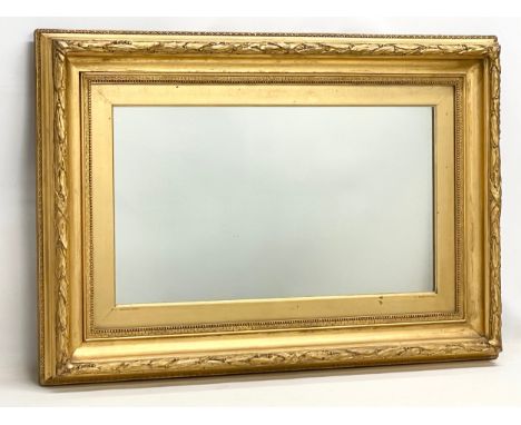 A large heavy Victorian gilt framed mirror. 100x9x70cm 