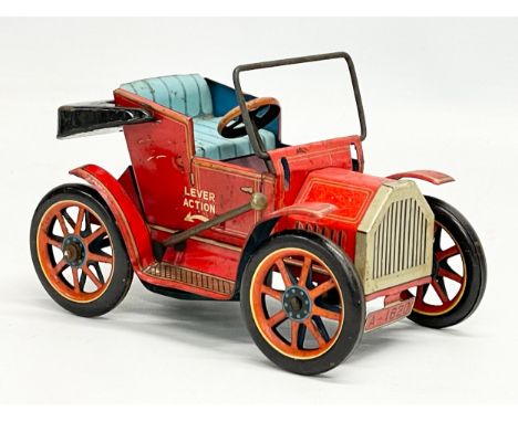 A vintage tinplate lever action toy car. Modern Toys, Japan. 14cm 