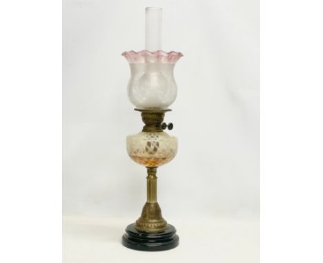 A large Victorian brass double burner oil lamp, with etched and Cranberry Glass shade. 73cm 