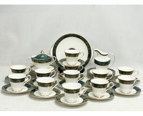 A 39 piece Royal Doulton ‘Carlyle’ tea set. 12 cups, 12 saucers, sugar bowl with lid, milk jug, cake plate, 12 sandwich plate