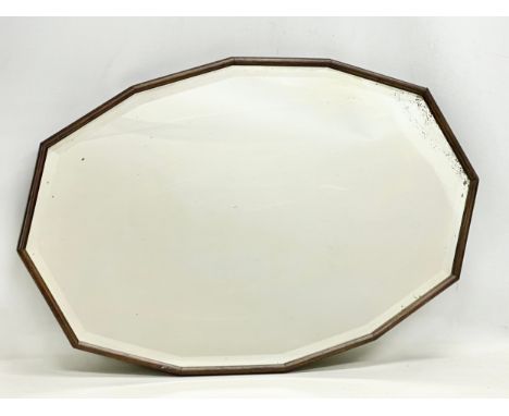 An early 20th century oak framed bevelled mirror. Circa 1920. 74x49cm 