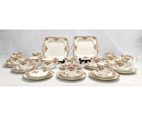 A 40 piece vintage tea set including 2 cake plates. 