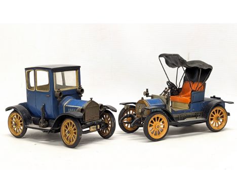 2 vintage Schuco models of Ford 1227 and Opel 1228 'Doktorwagen' model 1909. Made in West Germany. 1 measures 16.5x11cm 