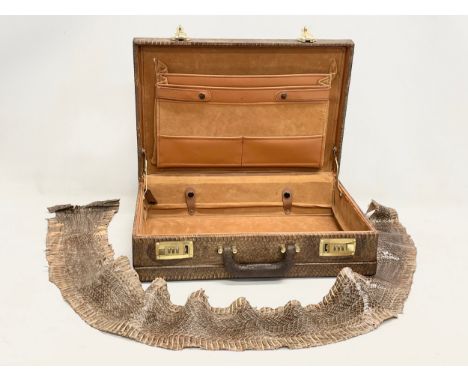A vintage snake skin briefcase. With a large snake skin. Briefcase measures 44x31x11cm. 