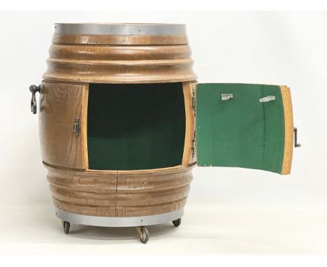 A vintage oak cocktail drinks cabinet in the form of a keg. 51x54cm 