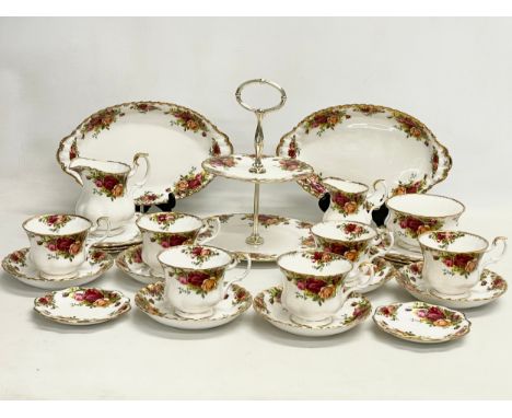 A 26 piece Royal Albert Old Country Roses tea set. Cake stand, a pair of serving dishes, 6 sandwich plates, 6 cups, 6 saucers