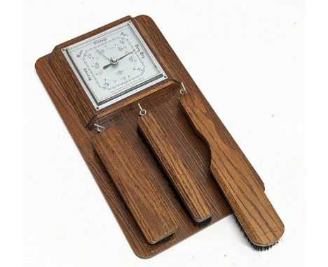 A vintage oak wall hanging barometer vanity unit. 23x38cm 