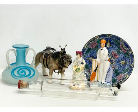 A sundry lot. Including a large Sylvac pottery shire horse, a Royal Doulton plate, a large glass rolling pin bottle, an Art G