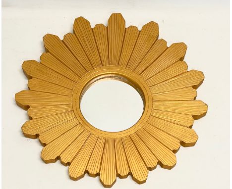 A gilt framed sunburst mirror. 60cm 