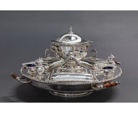 Circular, the rotating bain marie with shell-and-gadrooned rim, four opposing handles, fitted with three entree dishes, three