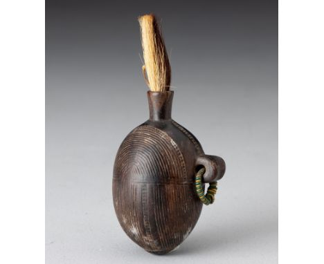 Round hollowed out container carved from one piece of small hard wood, complex incised linear designs, animal hair stopper, w