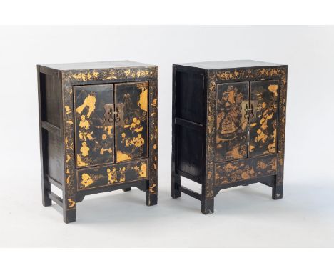 A PAIR OF CHINESE GILT LACQUERED CUPBOARDS, 20TH CENTURYEach rectangular top above a pair of doors enclosing a shelf, panelle