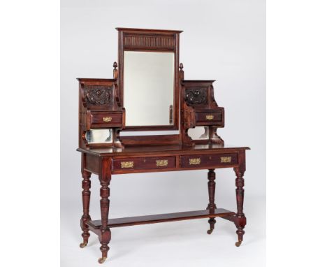 A MAHOGANY DRESSING TABLE, EARLY 20TH CENTURYThe rectangular top surmounted by a rectangular mirror flanked by drawers on fol