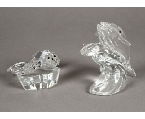 Two Swarovski figures,  the first "Save me" "The Seals", with certificate length 10.5cm, the second is the Whales, height 10c