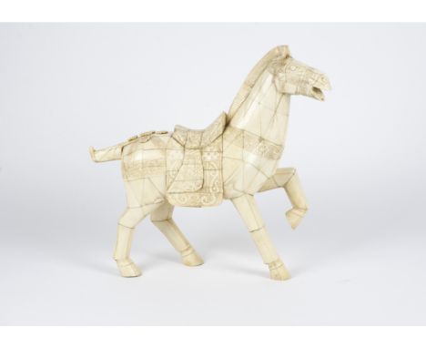 A Chinese bone horse statue of substantial proportions, in homage to the funerary wares of the Tang dynasty with raised front