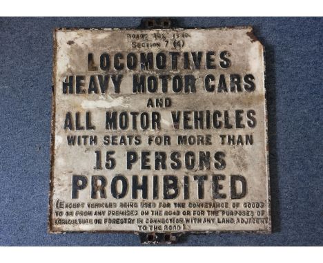 A vintage cast iron restriction sign, Locomotives, heavy cars and all other motor vehicles' Road act 1920, damage to upper le