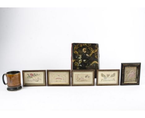 A papier mache blotting pad or cover,  with decoration of flora and fauna, 30cm x 24cm together with several framed embroider
