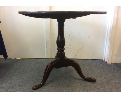 An antique oak circular tripod table, 75cm diameter x 69cm high 