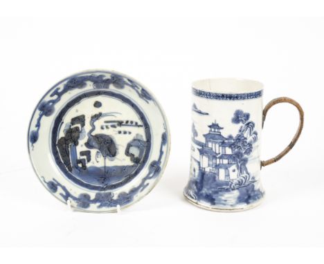 A Chinese export ware blue and white tankard with cane covered handle, the underglaze decoration depicting a typical watersid