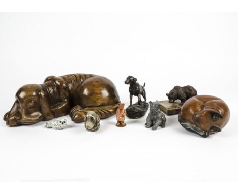 A quantity of dog and bear related collectables, to include a carved hardstone dogs head, large wooden carving of a sleeping 