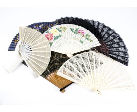 Seven 20th Century European and Asian folding fans, one with mother of pearl sticks and guards and a fabric leaf decorated wi