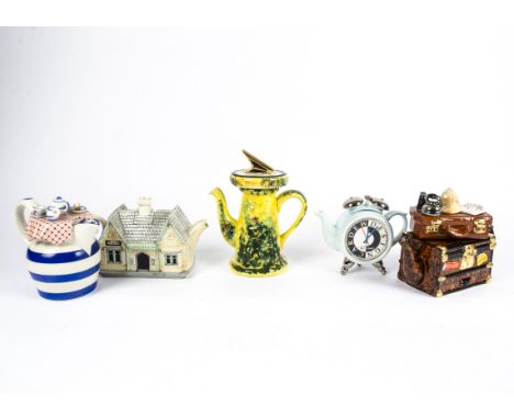 Novelty teapots,  mostly Swineside or Paul Cardew, these include a sundial and explorer suitcase, height of tallest 28cm (5) 