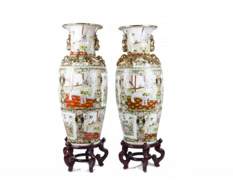 A pair of Chinese vases of substantial proportions on hardwood stands, the vases have multilobed everted rims revealing ruyi 