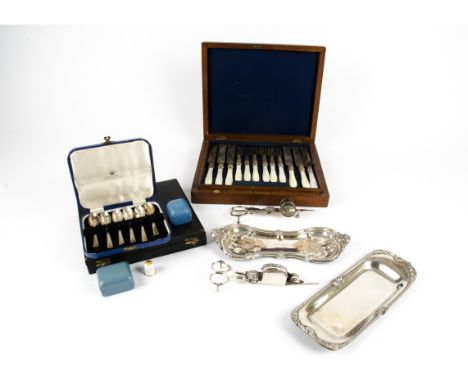 A selection of silver plated cutlery, including a set of knives and forks with mother of pearl handles and blades with etched