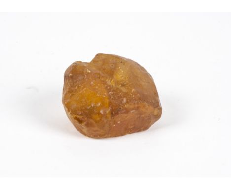 An Amber boulder of small size, uncut or polished, 7cm wide, 111g Provenance: believed to have been discovered in the Baltic 