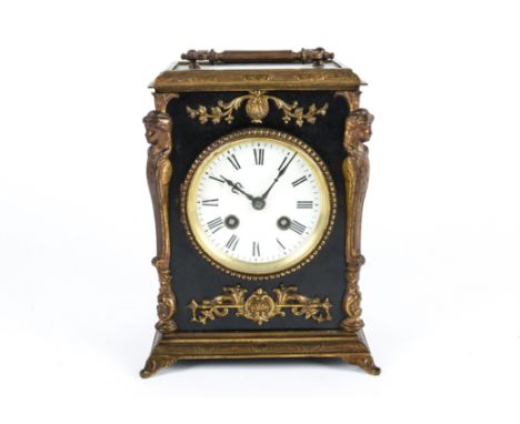 A 20th Century Regency style mantle clock, white tin plate dial with Roman numerals, within a black case with a metal framewo