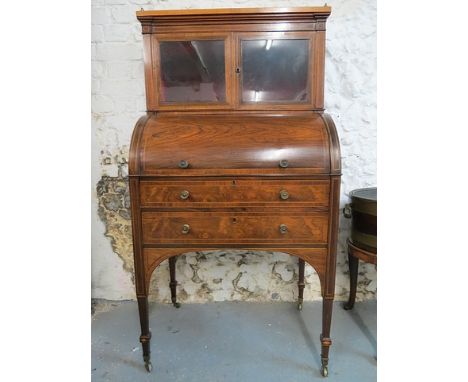 A late Victorian Sheraton revival ebony, boxwood string inlaid and crossbanded rosewood cylinder desk/display cabinet, the sa